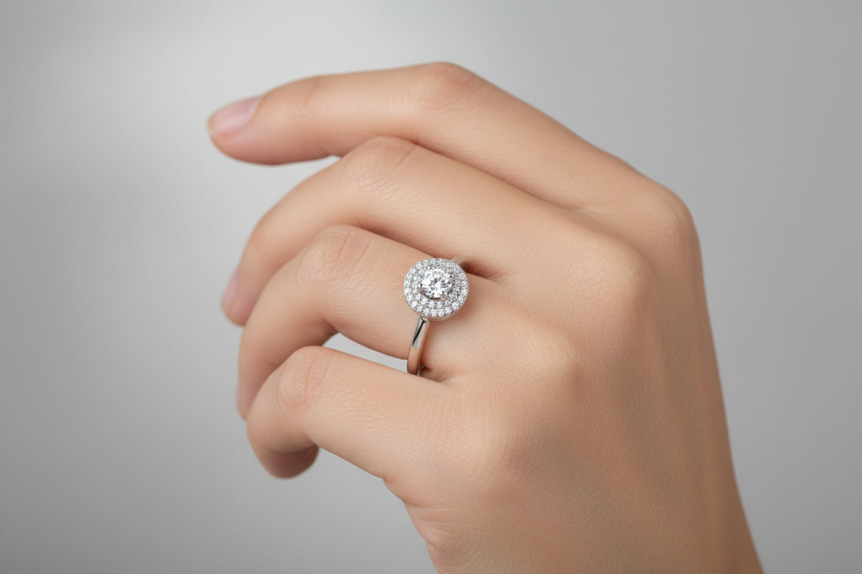 Silver ring with a diamond on a white background